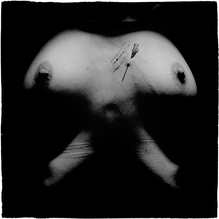 Slovenian photographer Goran Bertok is dealing with human body, pain, pleasure, violence and death. In his series of photographs Stigmata, the female body is exposed to self-harm, visible on the surface of the skin. Skin is a map, scars are paths.